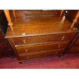 An early 20th century oak ledgeback chest of three long drawers, width 99cm