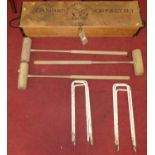 A Townsend boxed croquet set, together with further croquet clubs and hoops