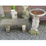 A reconstituted stone twin pedestal garden low bench seat, width 100cm, together with a