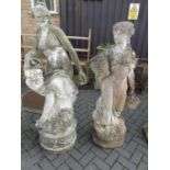 A near pair of large reconstituted stone garden figures, one later white painted in the form of a