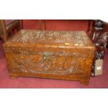 A small Eastern relief carved camphorwood hinge top low chest, width 55.5cm, together with a