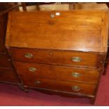 An early 19th century provincial elm and oak slopefront writing bureau, having a fitted interior