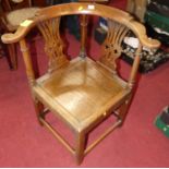 A circa 1800 provincial elm and oak panelled seat splatback tub corner chair