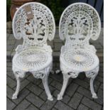 A pair of Victorian style galvanised metal, pierced and later white painted garden patio side