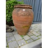 A terracotta garden olive pot, of ovoid form, height 70cmSolid and usable, hole drilled at base a