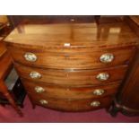 A Regency mahogany and chequer strung bow front chest, of four long graduated drawers with oval