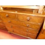 A mid-Victorian mahogany square front chest, of two short over three long graduated drawers,