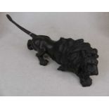 A Japanese bronze model of a lion, seal mark to the underside, length 40cmAppears to be complete and