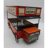 A Guinness tin-plated advertising bottle crate, in the form of a delivery truck, length 47cm