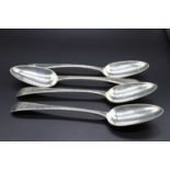 A set of four George III silver table spoons in the Old English Bead pattern, maker probably