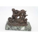 A 19th century French bronze figure group, modelled as two young children playing with a bird and