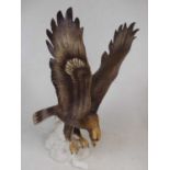 A Royal Dux porcelain model of an eagle, h.46cm