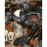 A large cast iron model of a rearing horse, h.71cm