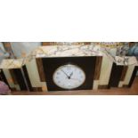 An Art Deco polished hardstone mantel clock garniture, w.46cm
