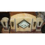 An Art Deco polished hardstone mantel clock garniture, the enamelled dial showing Arabic numerals,