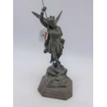 A 19th century spelter figure of Archangel St Michael, upon a wooden plinth, h.27cm