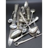 A small collection of silver and silver clad flatware to include silver plated toasting fork with