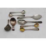 A George III silver caddy spoon of plain oval form together with one other caddy spoon, various