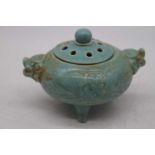 A Chinese export censer, of squat circular form on a turquoise ground, having twin shi-shi mask