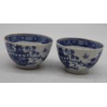 A pair of 19th century porcelain tea bowls, underglaze blue decorated in the Chinese style with