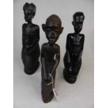 A matched set of three African carved hardwood figures, each in seated pose, largest h.30cm