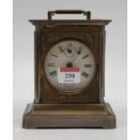 An early 20th century continental base metal cased carriage clock, the circular enamel dial with