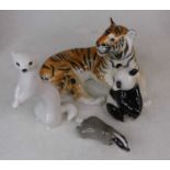 A Lomonosov model of a tiger, h.17cm; together with three further animal figures