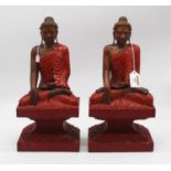 A pair of carvings of Buddha, shown in seated pose, h.37cm