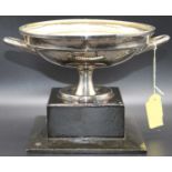 A Venetian white metal shallow bowl, stamped 800 on ebonised plinth, height 15cm