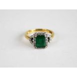 An 18ct yellow and white gold, emerald and diamond rectangular cluster ring, featuring a centre