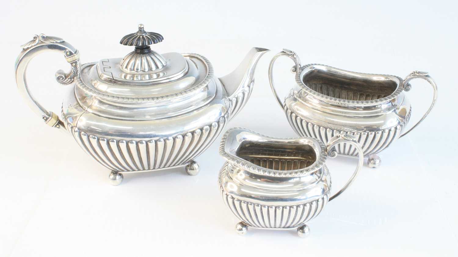 A late Victorian silver three-piece tea set, comprising teapot, sugar and cream, each piece of