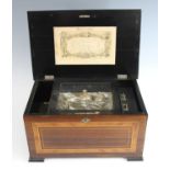 A late 19th century Swiss rosewood and kingwood inlaid music box, the 6" cylinder playing eight airs