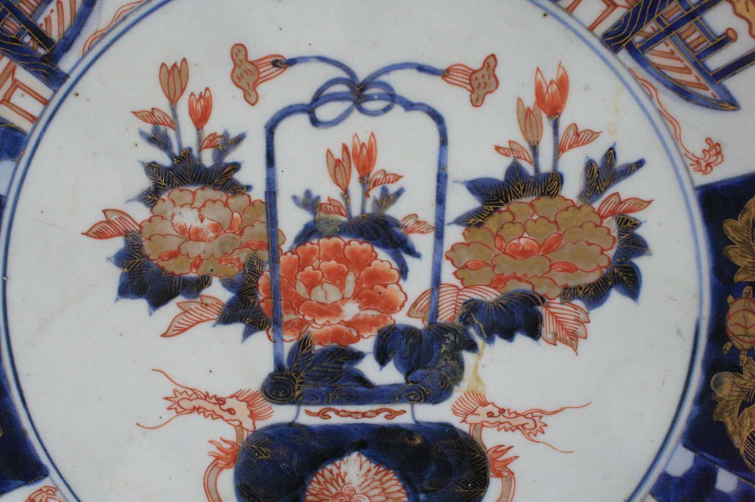 A Japanese Imari porcelain charger, 18th century, decorated with a basket of flowers within a border - Image 2 of 4