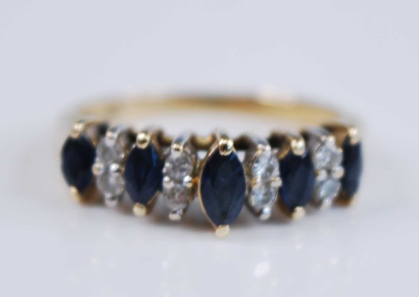 A yellow metal sapphire suite, comprising a sapphire line bracelet featuring 18 oval faceted - Image 7 of 11