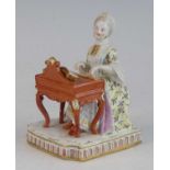 A Meissen porcelain figure of a lady, late 19th century, shown in 18th century dress, seated playing