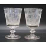 A pair of glass rummers, early 19th century, the bucket bowls etched with a ship beneath a bridge