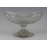 A cut glass pedetal bowl, probably Irish, 19th century, of navette form, the faceted stem above a
