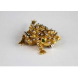 A yellow and white metal toad brooch, with beaded detail to the body and 2.9mm round cabochon