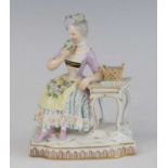 A Meissen porcelain figure of a lady, late 19th century, shown in 18th century dress, representing