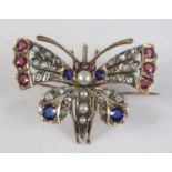 A yellow and white metal multi-stone butterfly brooch, the wings set with 24 rose cut diamonds,