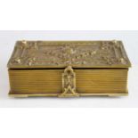A Victorian Scottish gilt metal cigar box disguised as a book, the hinged cover cast with trailing