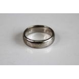 An 18ct white gold 6mm court shaped wedding band, size T½, gross weight 10.9g, hallmarked 18ct white