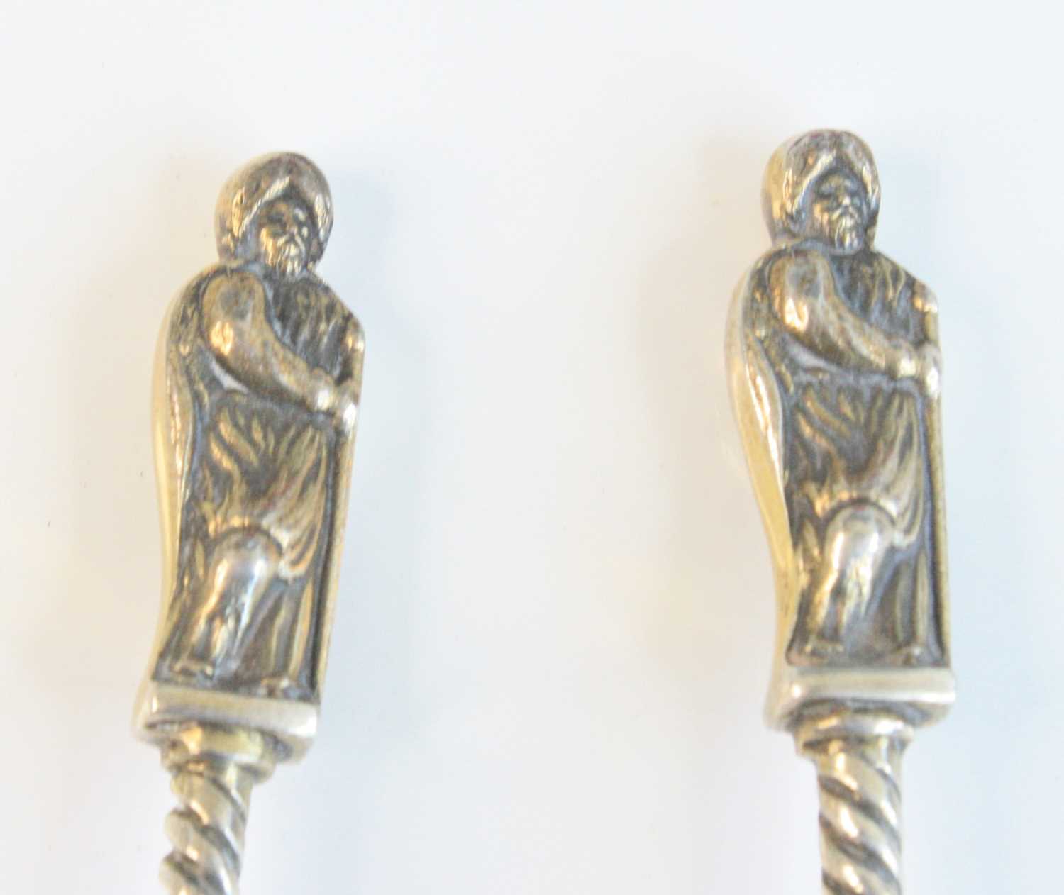 A cased set of four Victorian silver apostle spoons, having Apostle cast terminals upon spiral- - Image 3 of 8