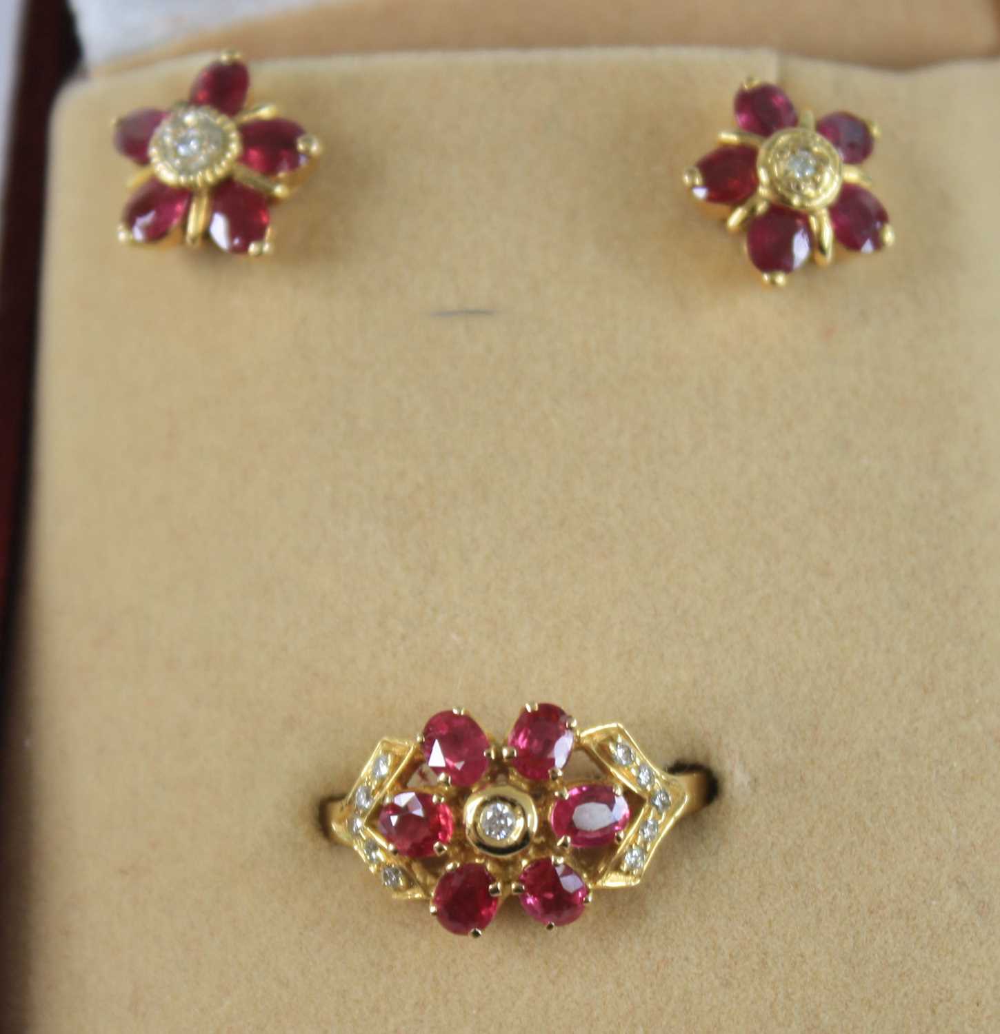 An 18ct yellow and white gold ruby and diamond oval cluster ring, featuring a centre oval facetted - Image 12 of 12