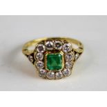 A yellow metal, emerald and diamond rectangular cluster ring, featuring a centre octagonal cut