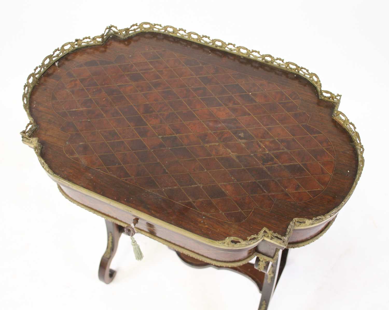 A late 19th century French walnut crossbanded and inlaid gueridon table, having a pierced brass - Image 2 of 4