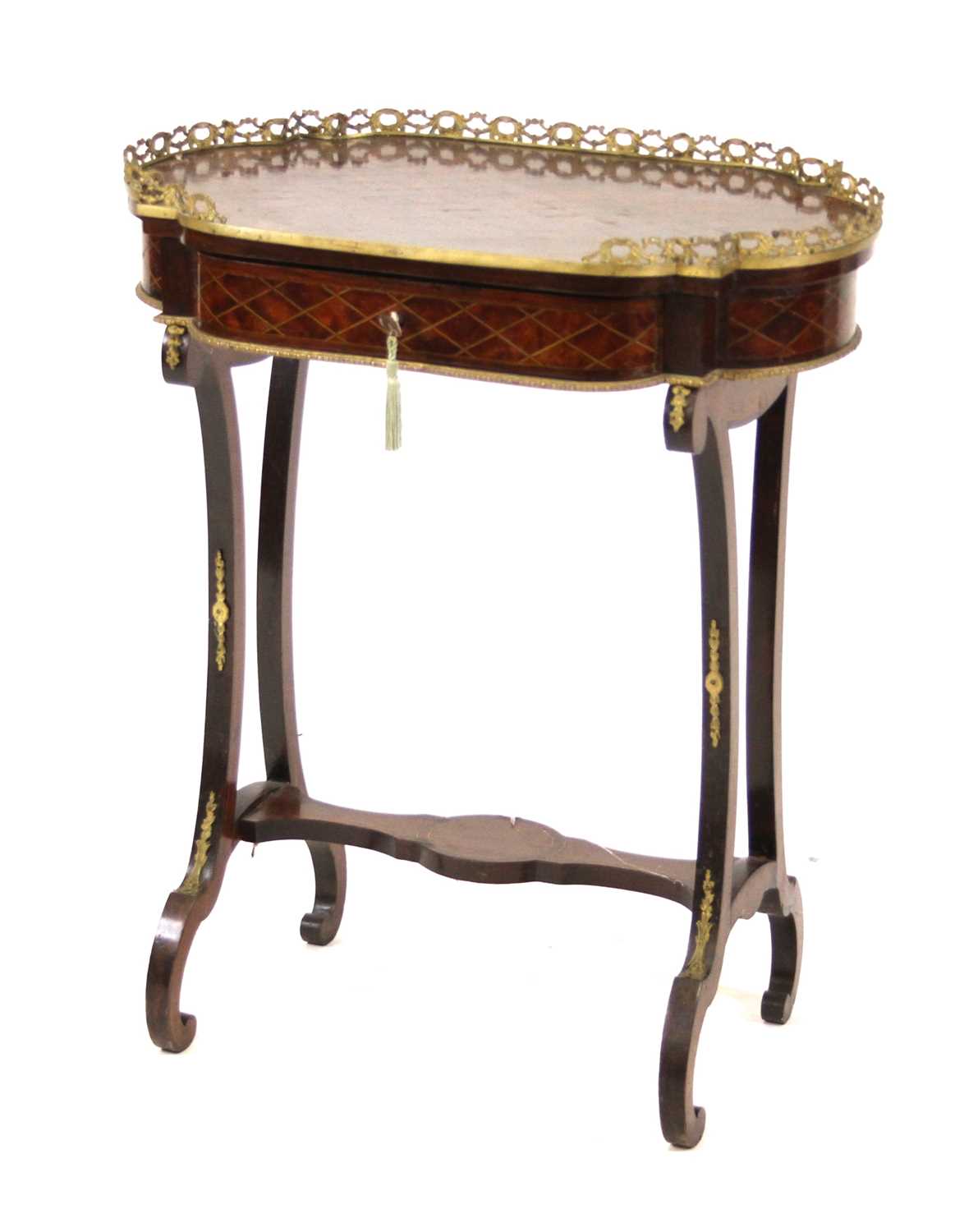 A late 19th century French walnut crossbanded and inlaid gueridon table, having a pierced brass