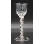 A cordial glass, circa 1770, the half ribbed ogee bowl above a double series opaque twist stem, h.