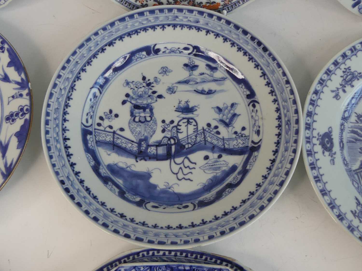 A collection of 18th century Chinese export porcelain plates and dishes, to include enamel decorated - Image 15 of 23