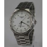 A gent's Longines Conquest steel cased quartz wristwatch, having a signed white dial with luminous